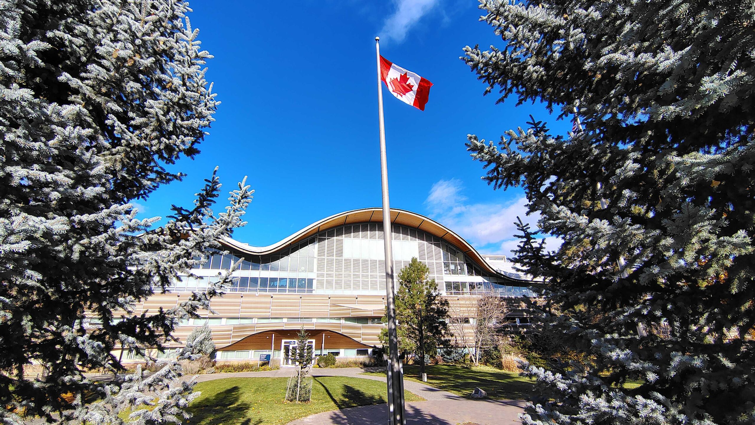 Thompson Rivers University Old Main building with Canadian flag.